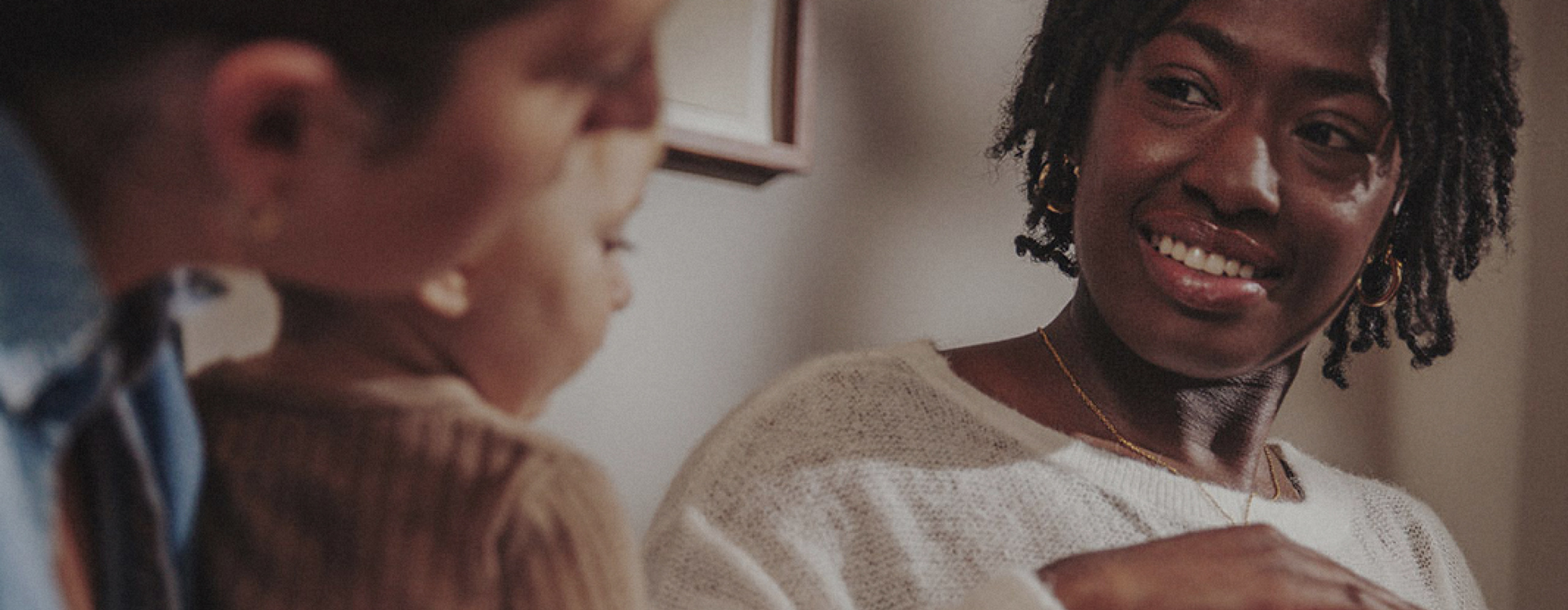 Two people engage in a warm conversation, fostering connection and support.