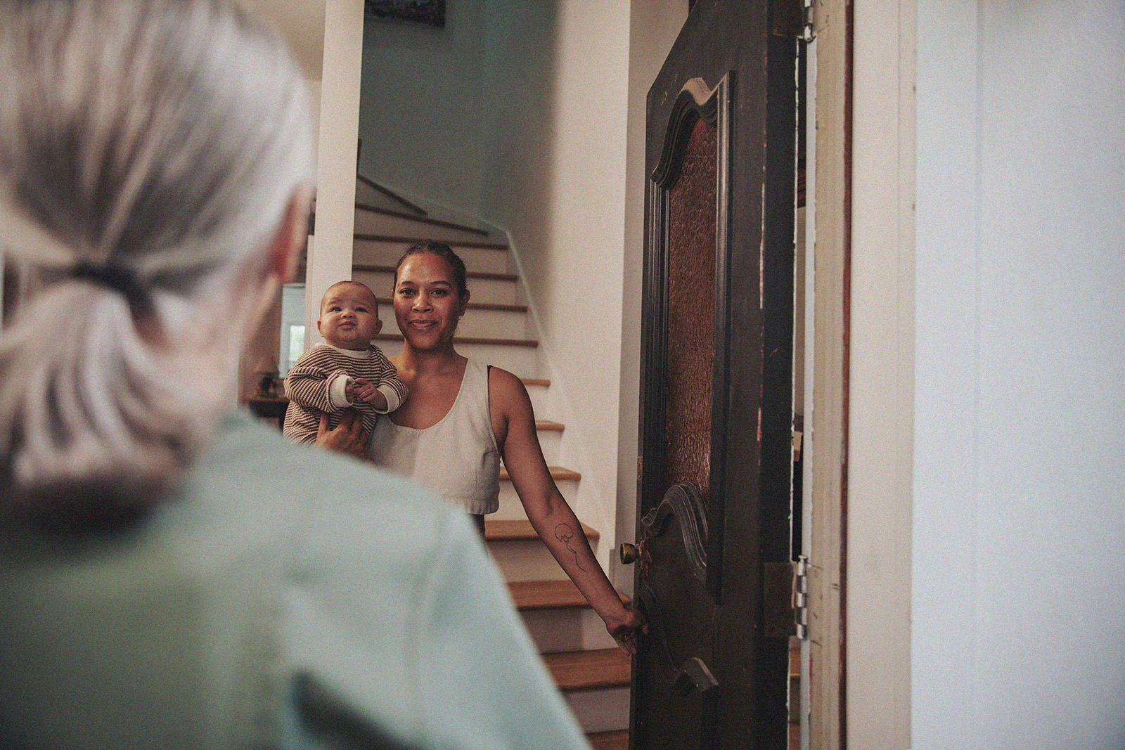 An International Board Certified Lactation Consultant arrives at a family’s home, offering in-home support.