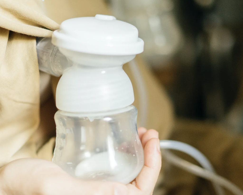 A close-up of a breast pump being used to extract milk.